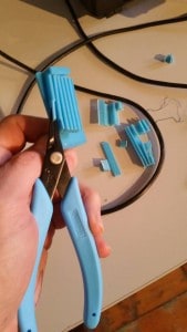 Xuron® Model 450 Plier being used to remove post-printing support material.