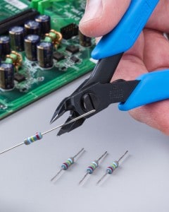 Precision wire cutters manufactured by Xuron Corporation cut printed circuit board lead wires