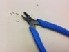 Wire Retaining Clip keeps cut pieces of wire from littering your workspace