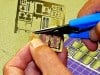 Demonstrating the proper technique for cutting photo etch from the fret
