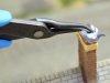 The Model 450BN Bent Nose Pliers can hole and place small detail pieces