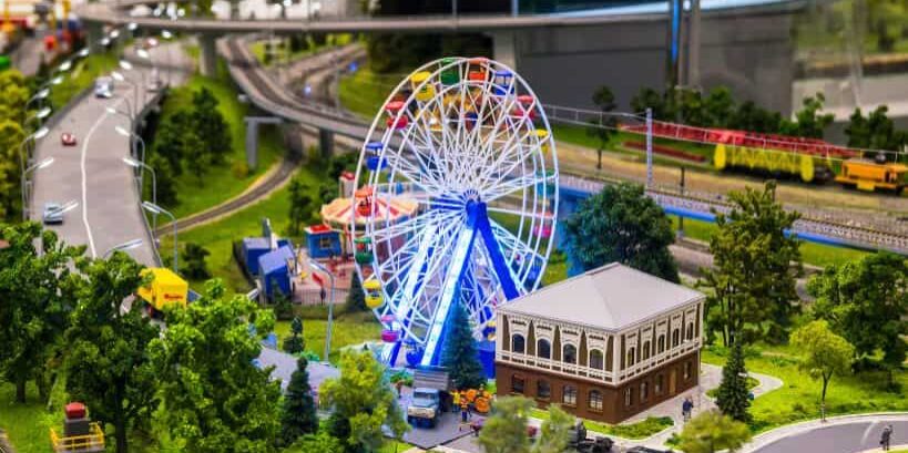 A model railroad layout featuring a brightly lit ferris wheel introduces the Xuron® DCC wiring tool duo.