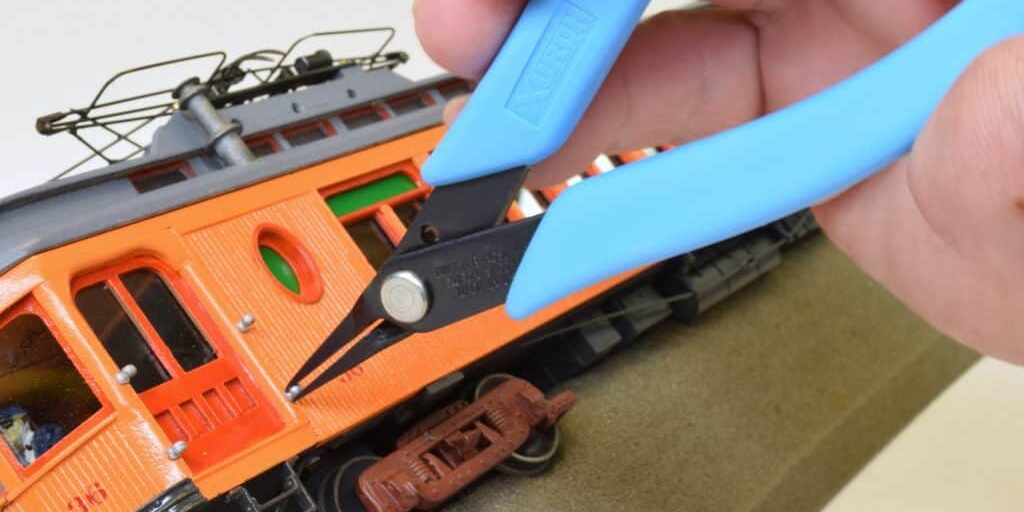 xuron-model-450-pliers-installing-stanchion-pins-on-model-railroad-car Xuron® Model 450 TweezerNose Plier being used to put the finishing touches on the Someset County Ol' Number 36