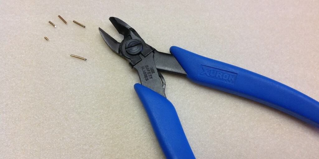 Xuron® Model 9100F Oval Head Micro-Shear Flush Cutter Wire Retaining Clip keeps cut pieces of wire from littering your workspace